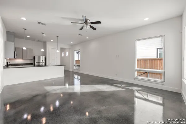 a view of a kitchen with a sink and a window