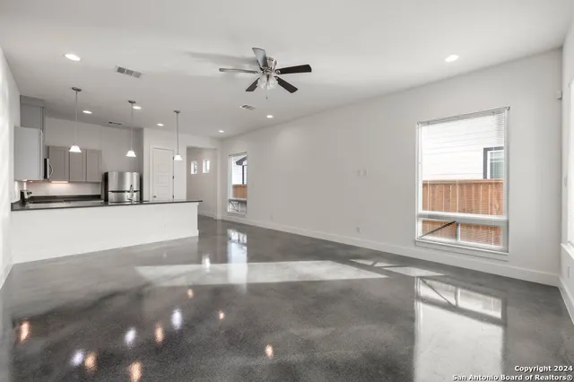 a view of a kitchen with a sink and a window