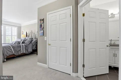 a living room with furniture and a closet