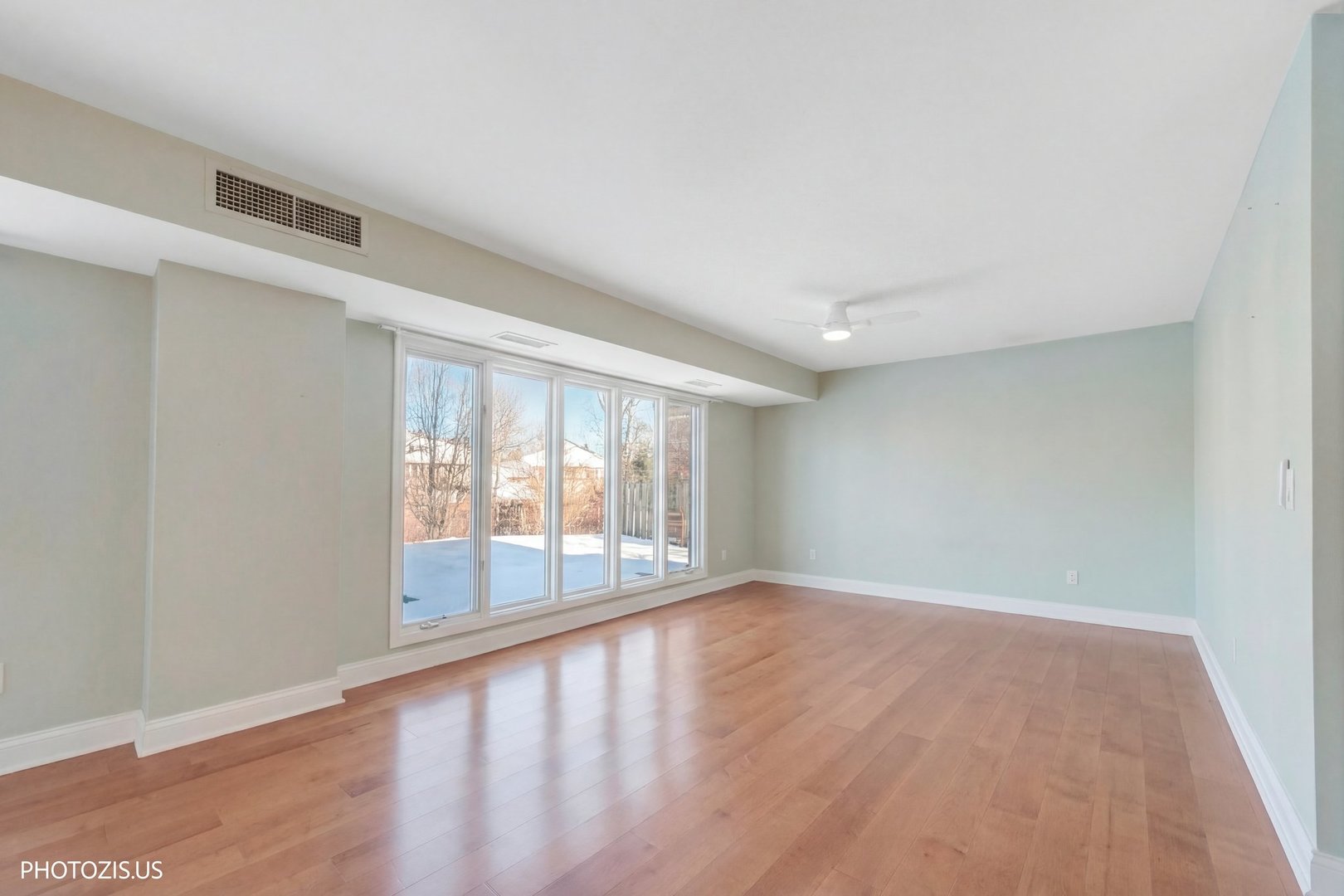 1621 Mission Hills Road, Unit 108 Northbrook, IL 60062 - Photo 6 of 22 wooden floor in an empty room with a window