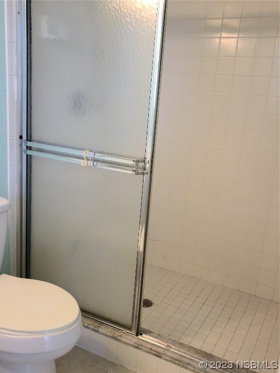 6544 Engram Road, Unit E203 New Smyrna Beach, FL 32169 - Photo 11 of 27 a bathroom with a toilet and a shower