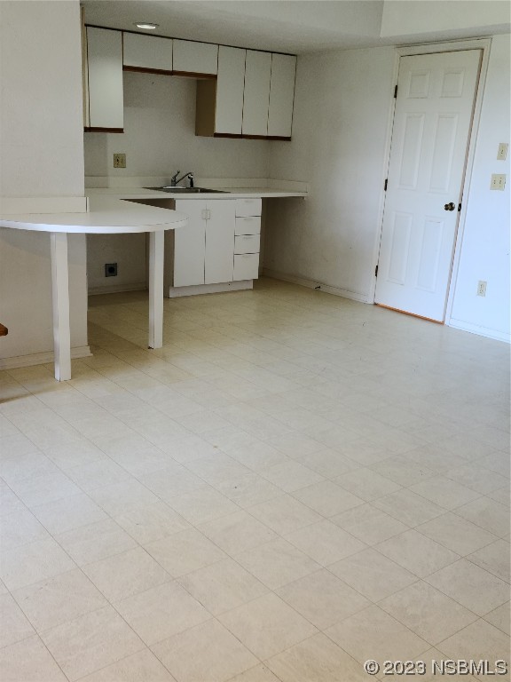 6544 Engram Road, Unit E203 New Smyrna Beach, FL 32169 - Photo 12 of 27 a view of cabinets and wooden floor