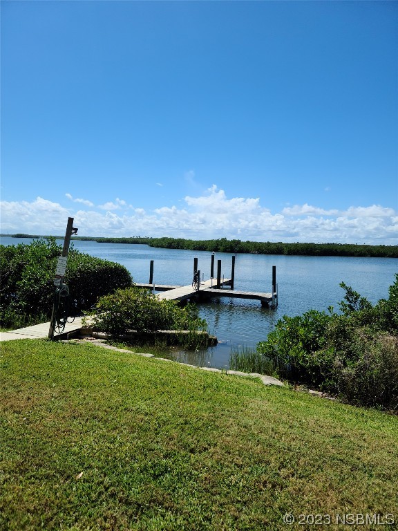 6544 Engram Road, Unit E203 New Smyrna Beach, FL 32169 - Photo 16 of 27 a view of a lake with a city view