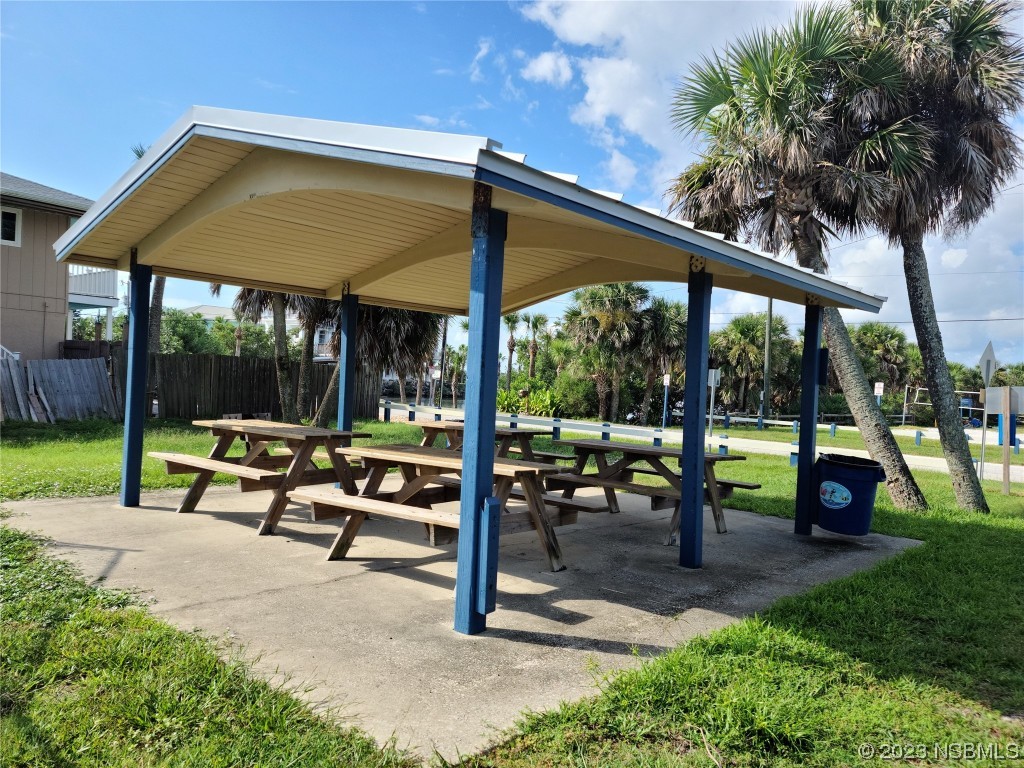 6544 Engram Road, Unit E203 New Smyrna Beach, FL 32169 - Photo 20 of 27 a view of outdoor space yard deck patio and swimming pool