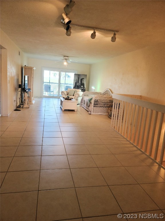 6544 Engram Road, Unit E203 New Smyrna Beach, FL 32169 - Photo 4 of 27 a living room with couches and kitchen view