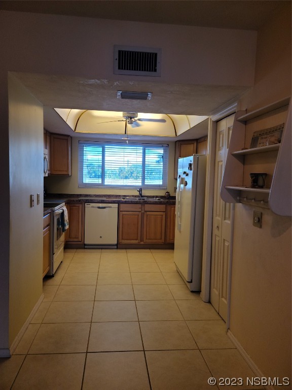 6544 Engram Road, Unit E203 New Smyrna Beach, FL 32169 - Photo 7 of 27 a kitchen with stainless steel appliances granite countertop a refrigerator and a stove