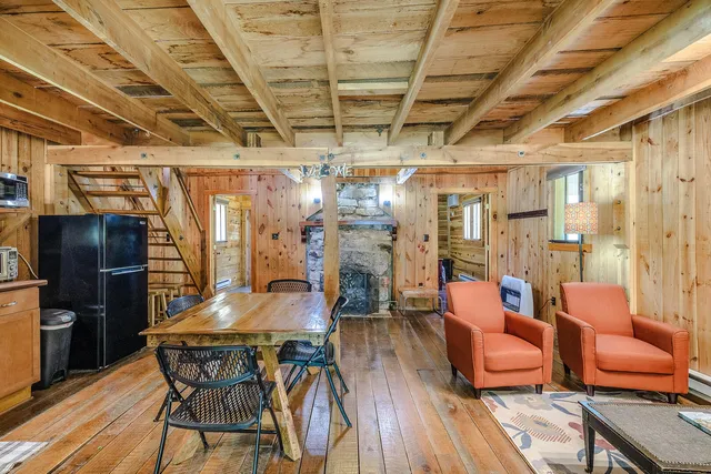 a bathroom with a granite countertop sink a mirror and toilet
