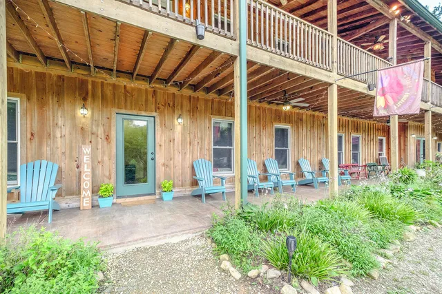 a front view of a house with a yard table and chairs