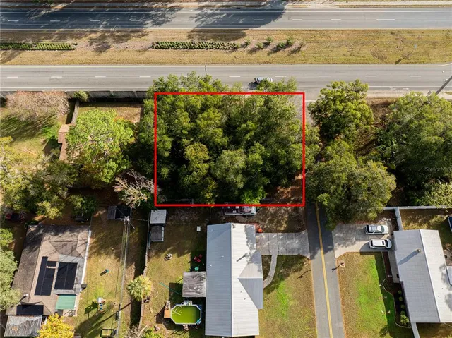 a view of a swimming pool with an outdoor seating