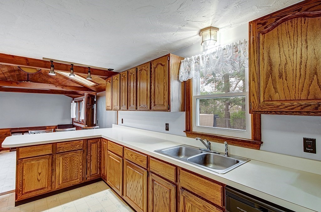 12 Haskell Road Pepperell, MA 01463 - Photo 6 of 35 a kitchen that has a sink and a stove