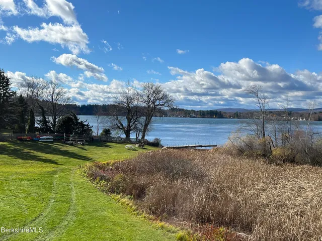a view of a livingroom with furniture and a flat screen tv