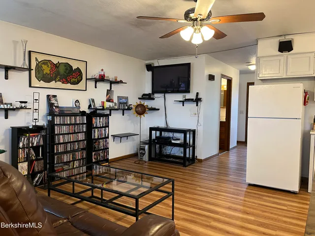 a bathroom with a sink mirror and toilet
