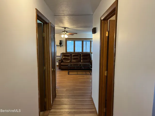 a view of a bedroom with cabinet and closet