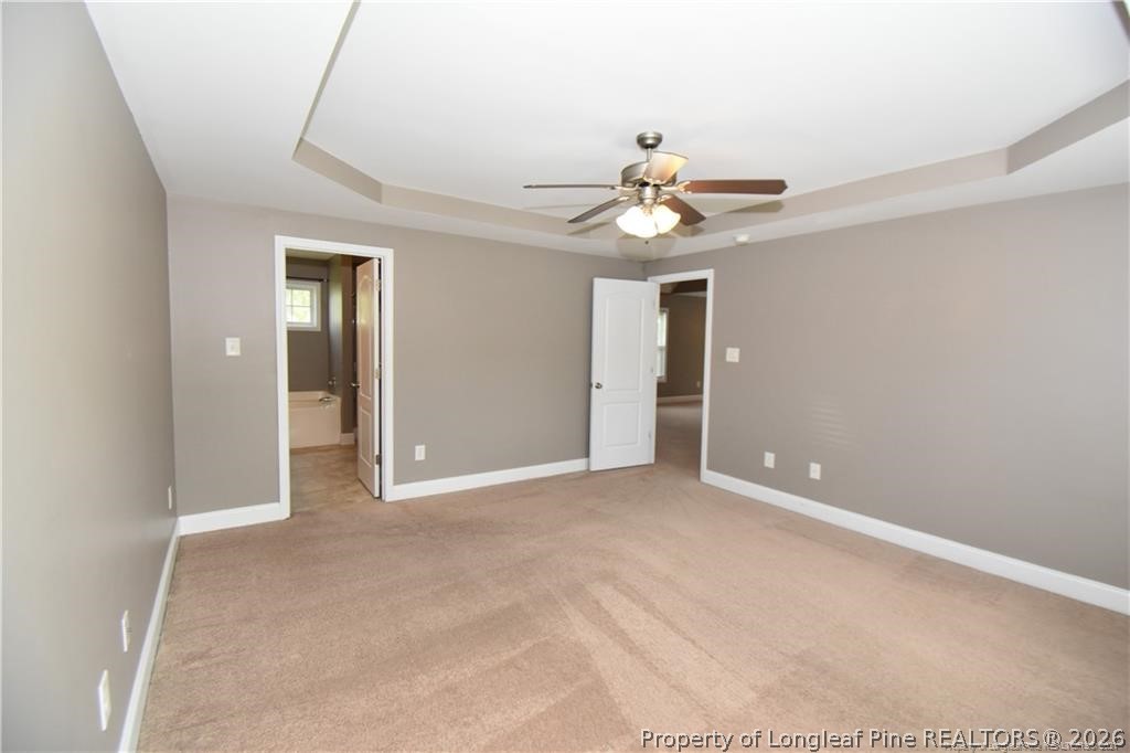 131 South Prince Henry Way Cameron, NC 28326 - Photo 9 of 26 a view of an empty room with a chandelier fan