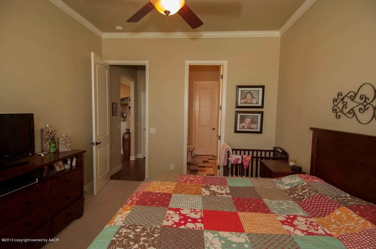3807 Arden Road Amarillo, TX 79118 - Photo 12 of 26 a bed room with a bed and a television