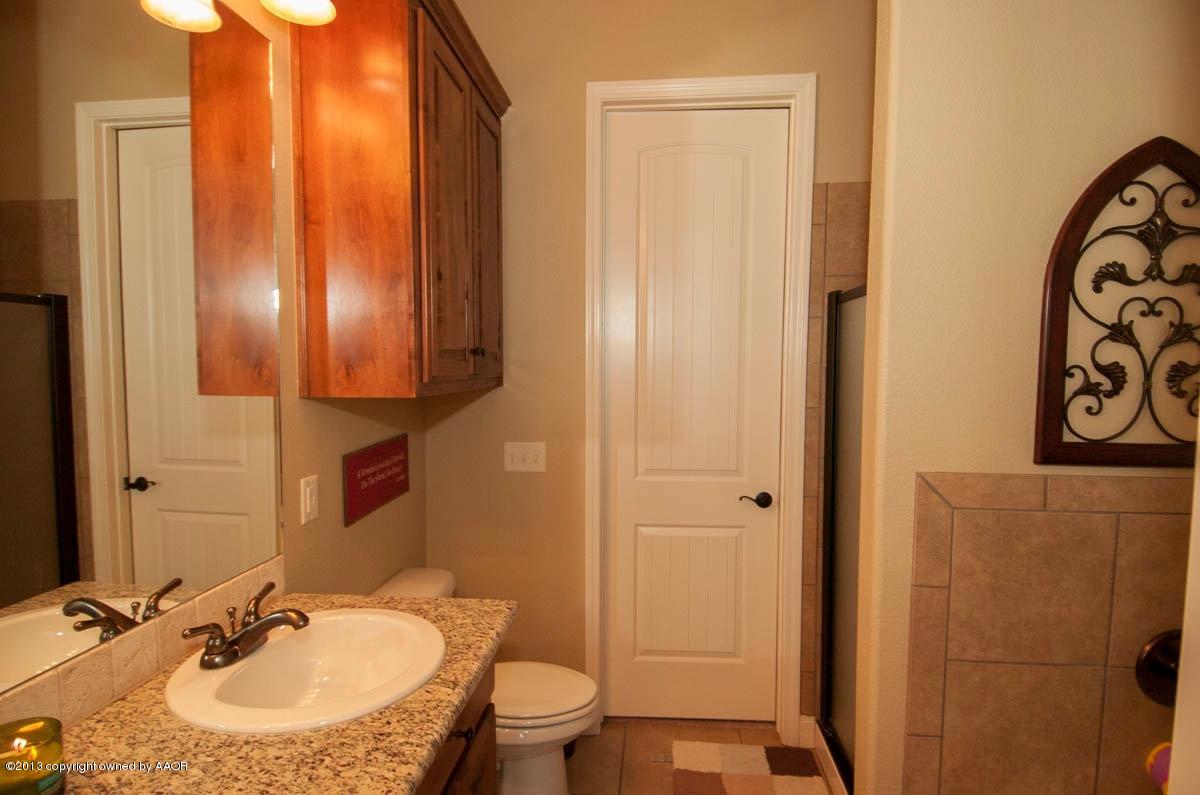 3807 Arden Road Amarillo, TX 79118 - Photo 15 of 26 a bathroom with a sink toilet and shower