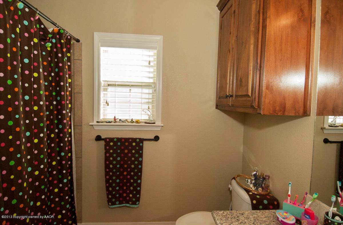 3807 Arden Road Amarillo, TX 79118 - Photo 19 of 26 a bathroom with a sink toilet and vanity