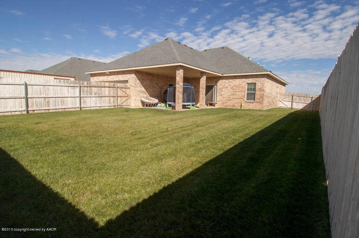 3807 Arden Road Amarillo, TX 79118 - Photo 25 of 26 a view of a big house with a big yard and large tree