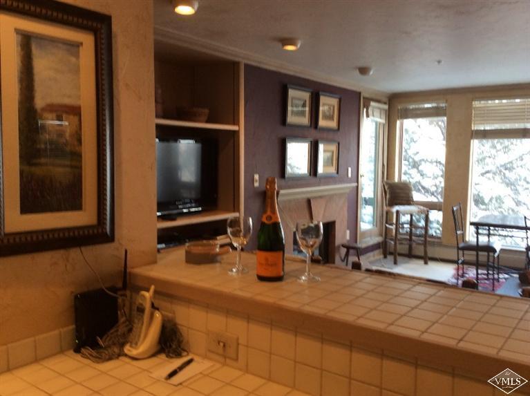 12 Vail Road, Unit R4 Vail, CO 81657 - Photo 7 of 23 a room with gym equipment and a large window