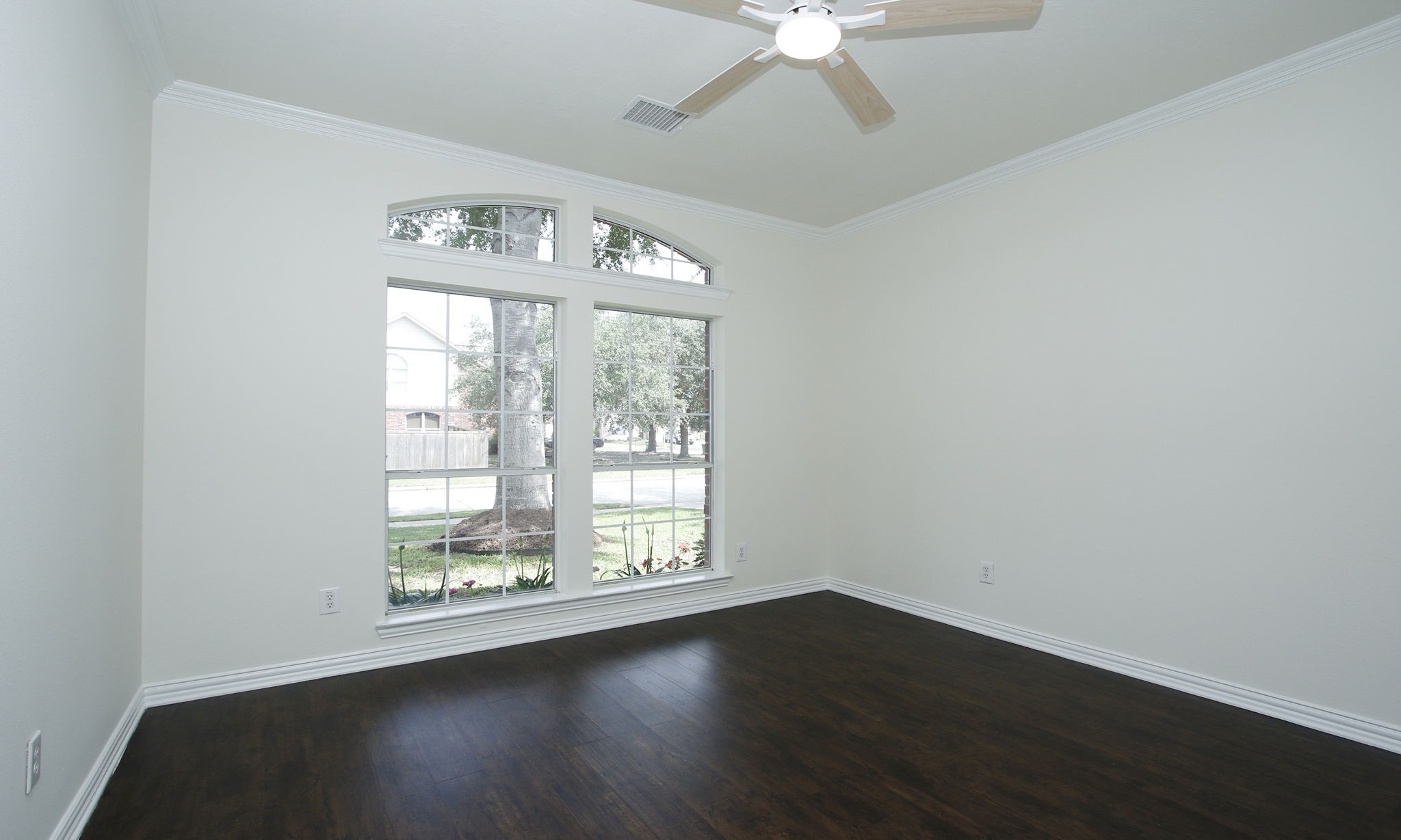 1210 Berwick Manor Court Spring, TX 77379 - Photo 13 of 50 an empty room with wooden floor fan and windows