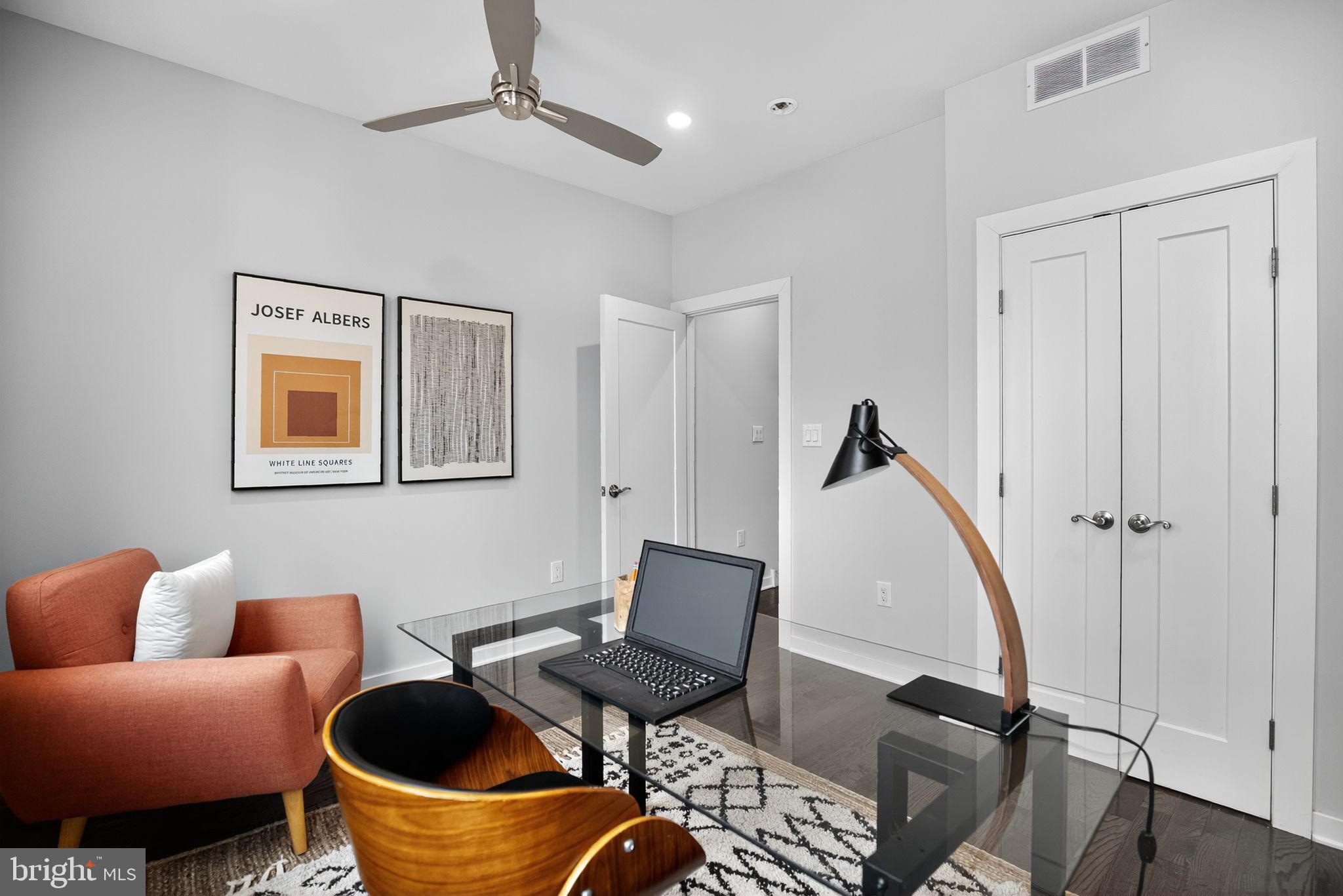 1711 South 20th Street Philadelphia, PA 19145 - Photo 12 of 36 a living room with furniture a rug and a painting