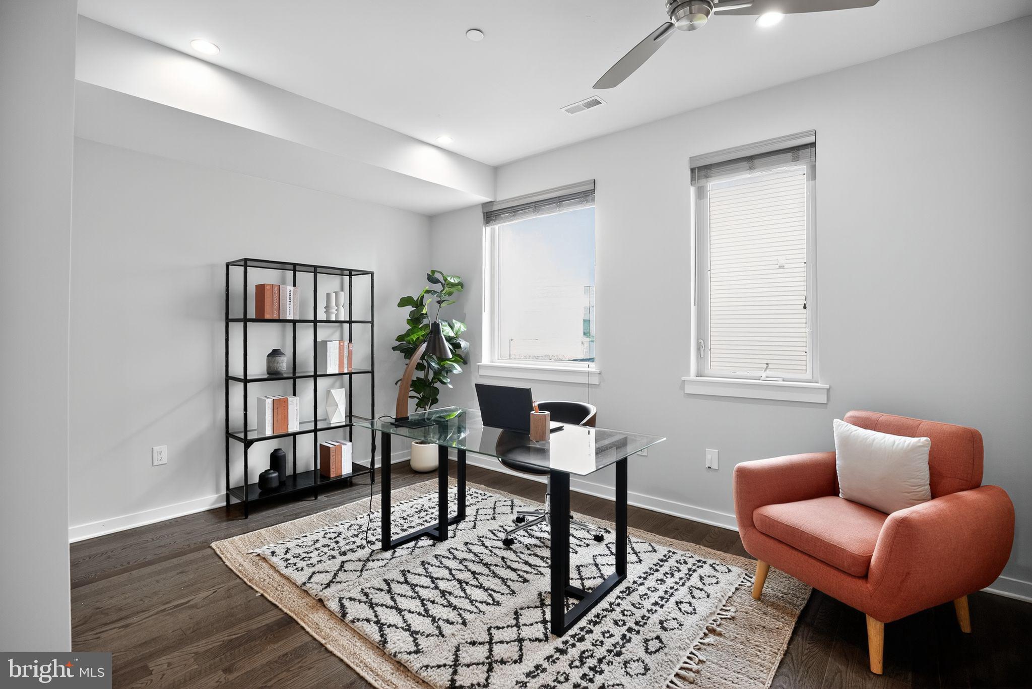 1711 South 20th Street Philadelphia, PA 19145 - Photo 13 of 36 a living room with furniture a rug and a window