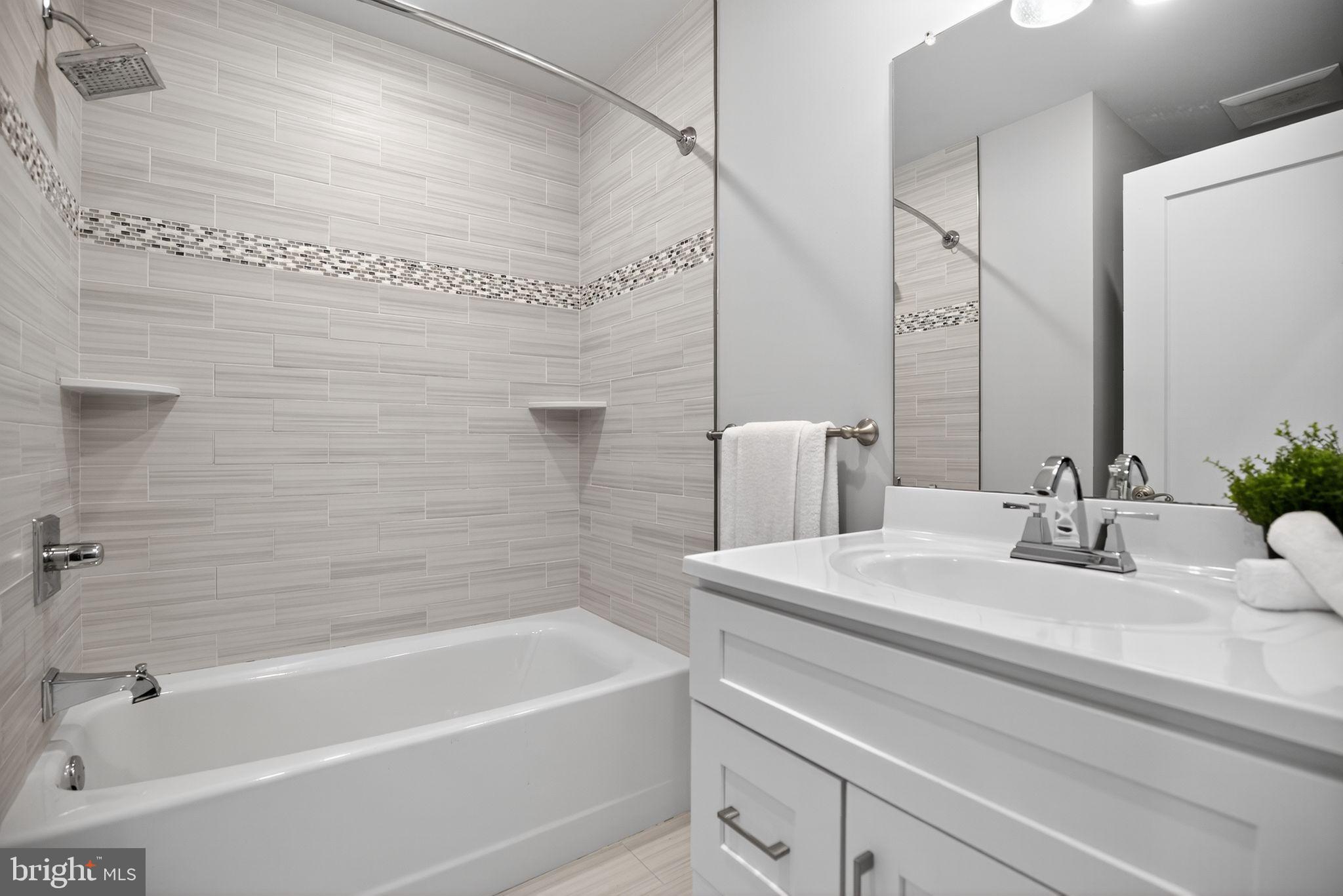 1711 South 20th Street Philadelphia, PA 19145 - Photo 14 of 36 a bathroom with a sink and a bathtub