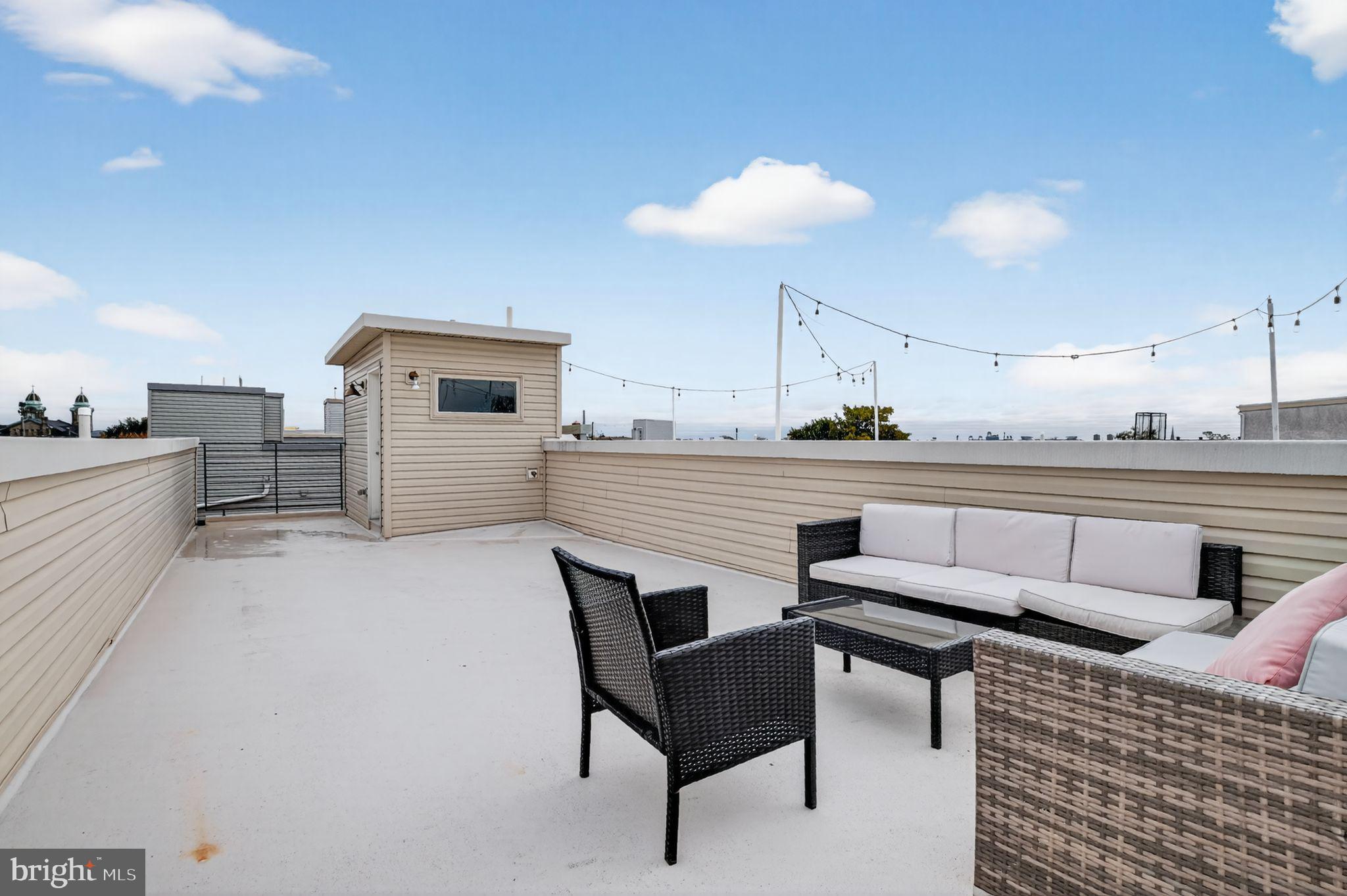 1711 South 20th Street Philadelphia, PA 19145 - Photo 23 of 36 a kitchen with a table chairs and a refrigerator