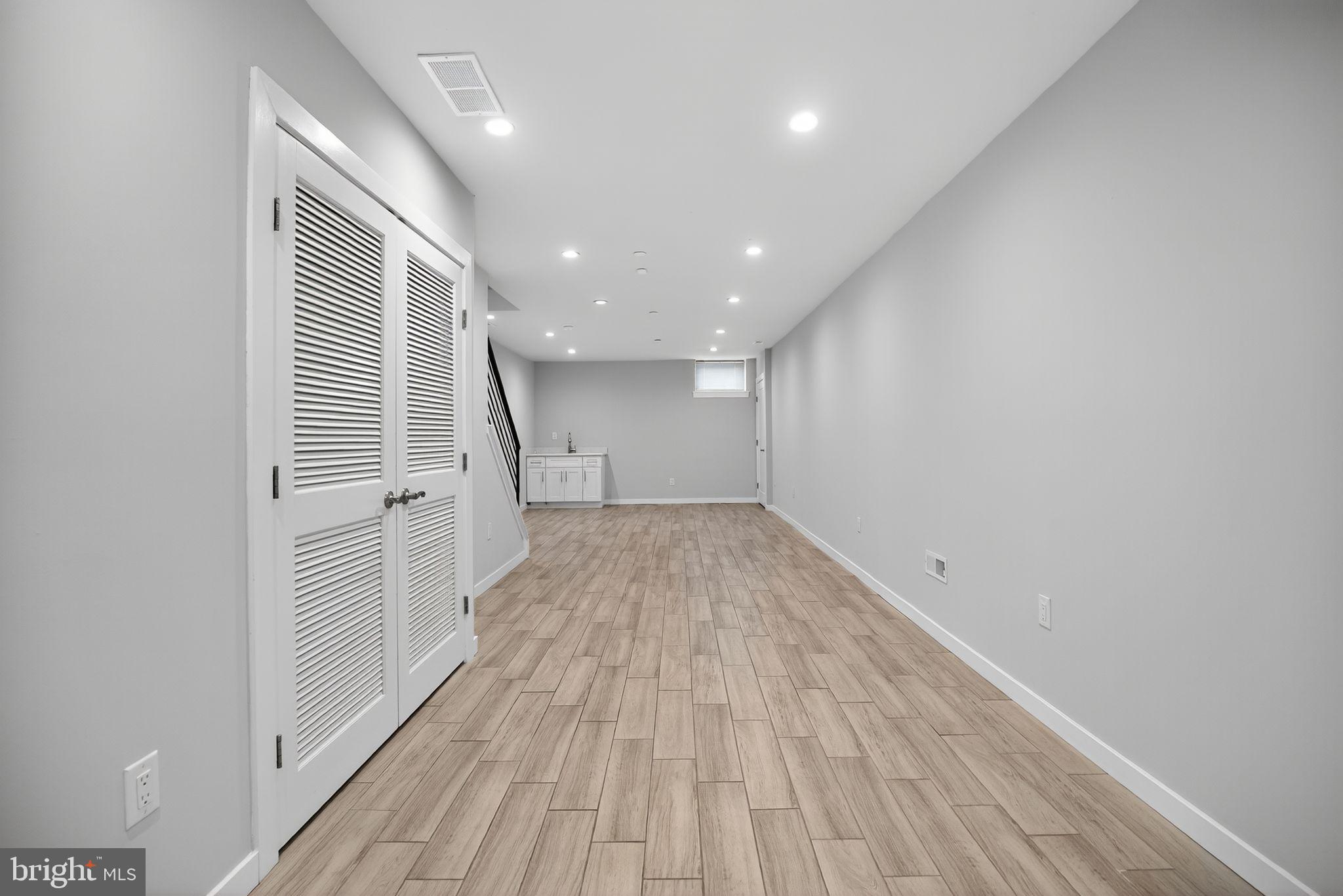 1711 South 20th Street Philadelphia, PA 19145 - Photo 27 of 36 a view of a room with wooden floor and staircase