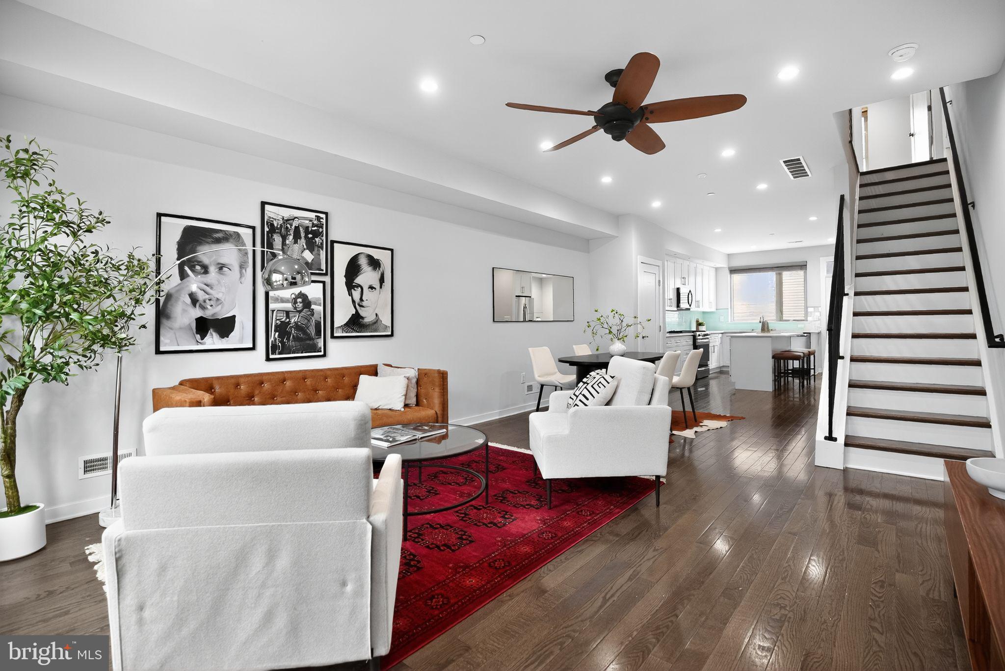 1711 South 20th Street Philadelphia, PA 19145 - Photo 3 of 36 a living room with furniture kitchen view and a potted plant