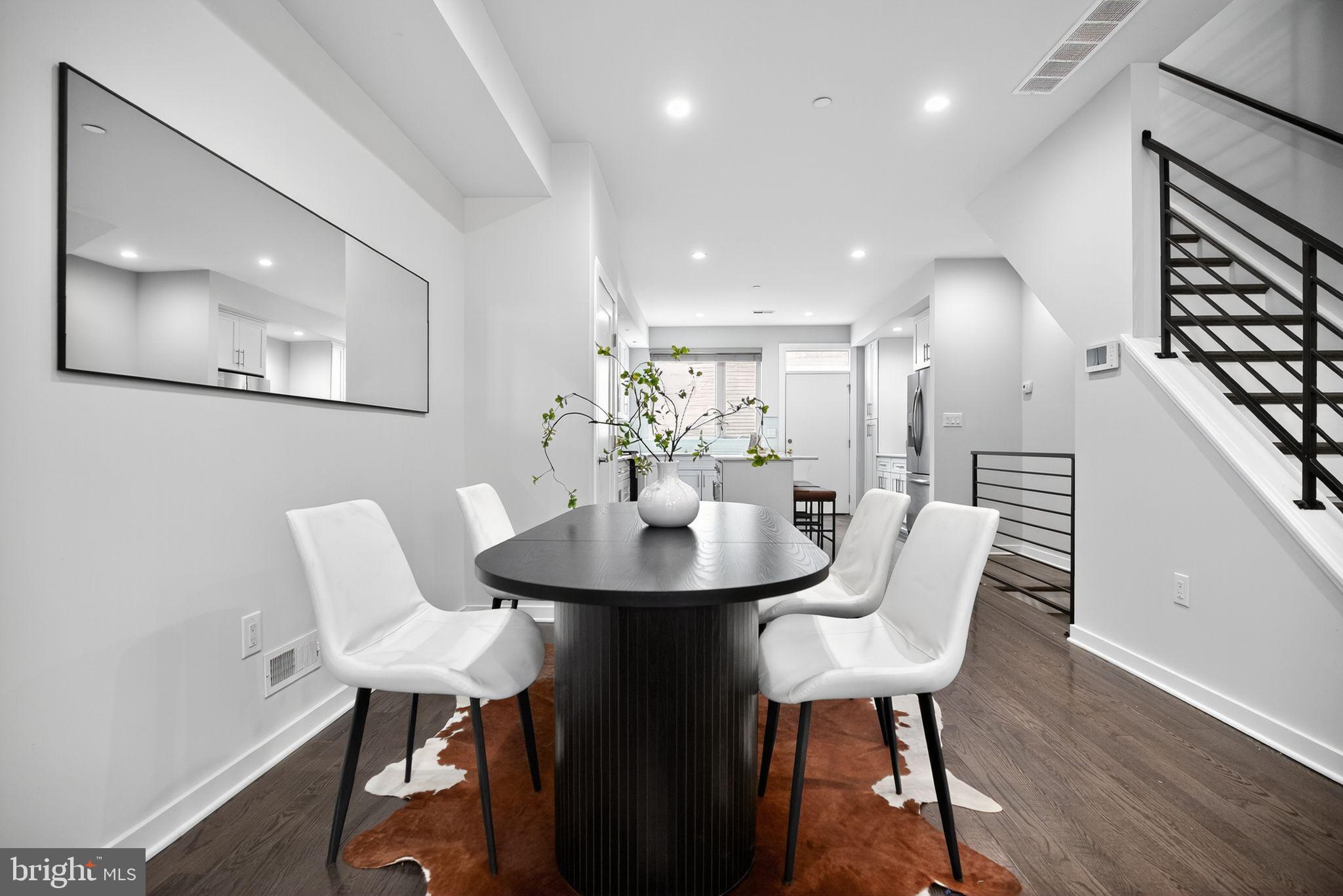 1711 South 20th Street Philadelphia, PA 19145 - Photo 5 of 36 a view of a dining room with furniture and wooden floor
