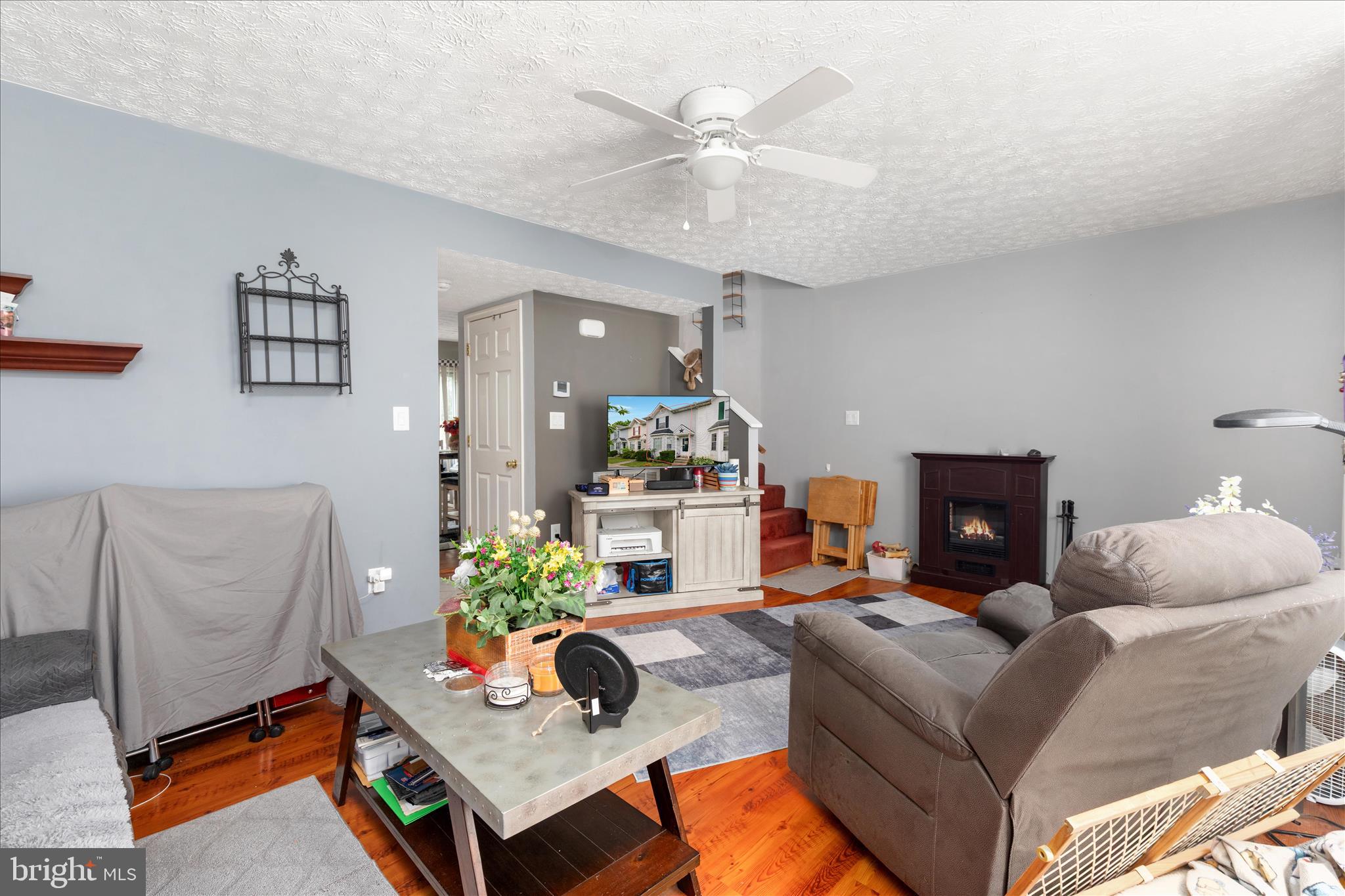 132 Stadium Circle Inwood, WV 25428 - Photo 11 of 25 a living room with furniture and a potted plant
