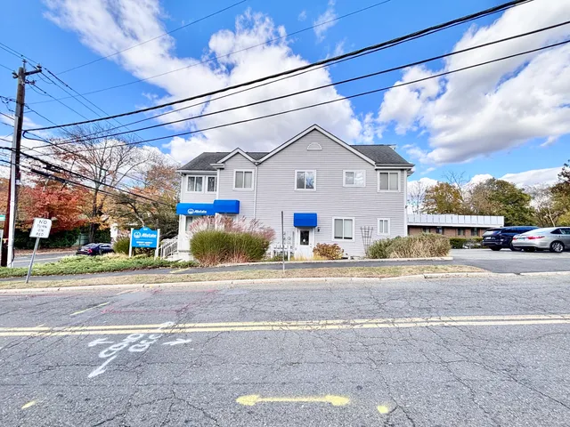 a view of a house with a street