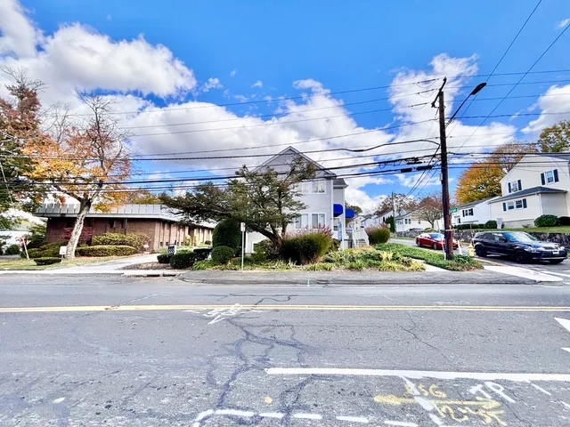 a view of a building with a street