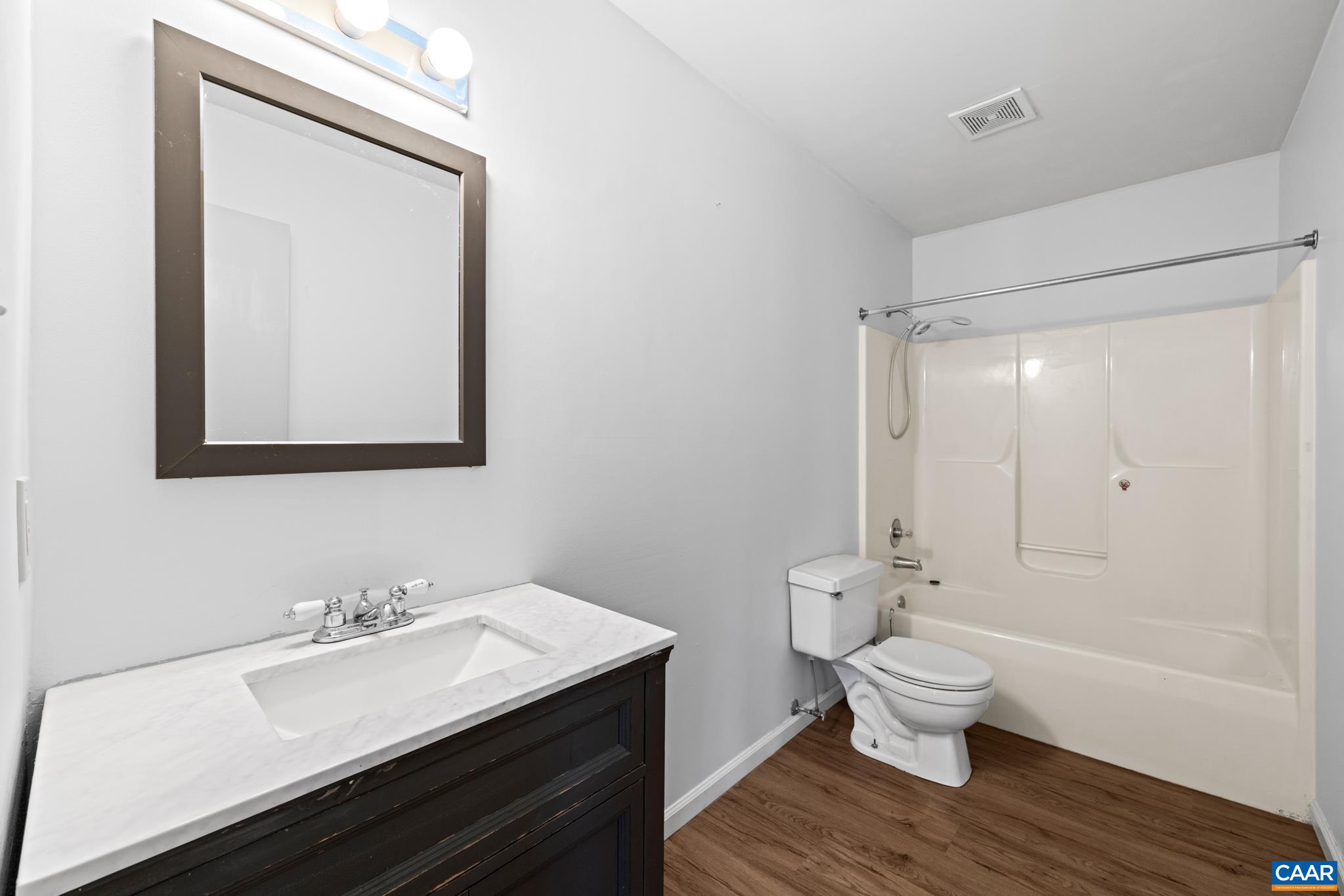 364 Larkspur Road Ruckersville, VA 22968 - Photo 15 of 29 a bathroom with a sink toilet and shower