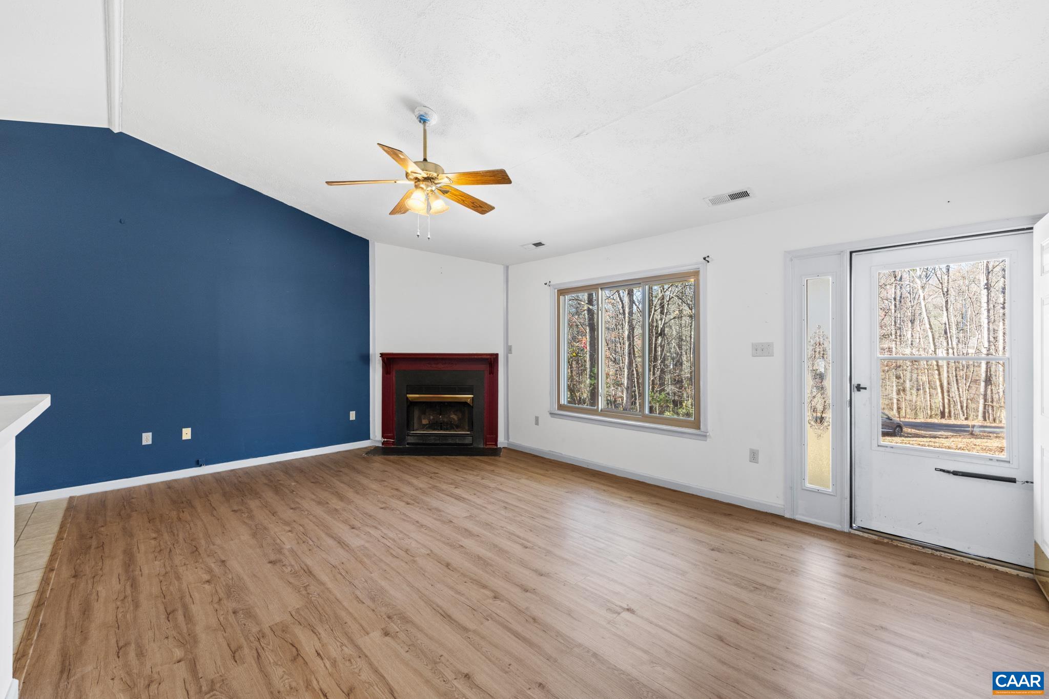 364 Larkspur Road Ruckersville, VA 22968 - Photo 8 of 29 a view of an empty room with a window and wooden floor