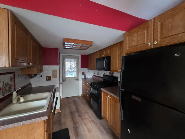 a bathroom with a mirror a sink and vanity