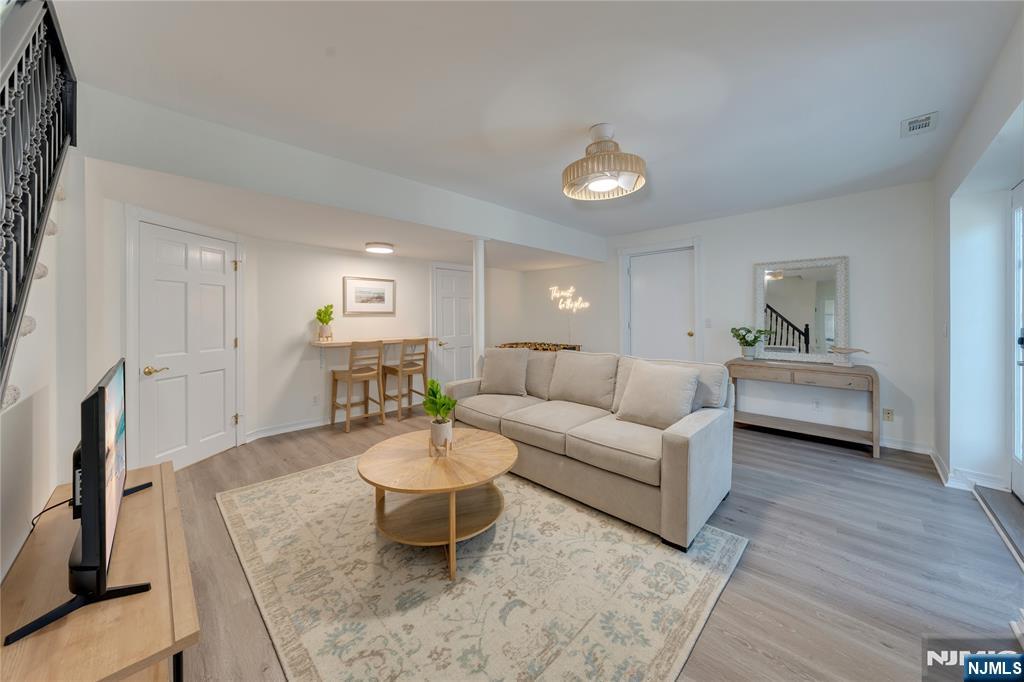 4006 Shore Road Villas, NJ 08251 - Photo 19 of 30 a living room with furniture and a wooden floor