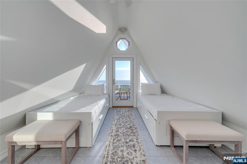 4006 Shore Road Villas, NJ 08251 - Photo 27 of 30 a living room with a chairs and a rug