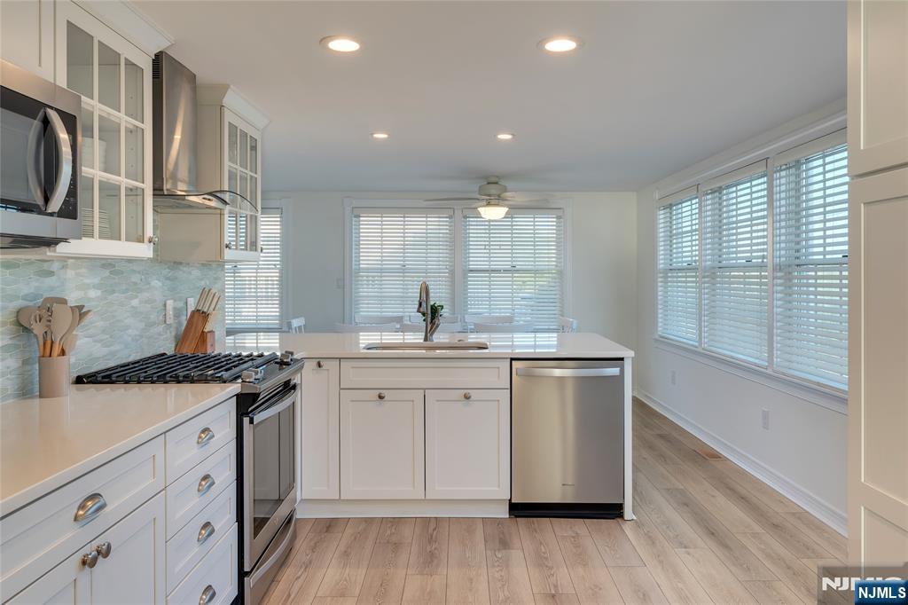 4006 Shore Road Villas, NJ 08251 - Photo 10 of 30 a kitchen with a sink stove and cabinets