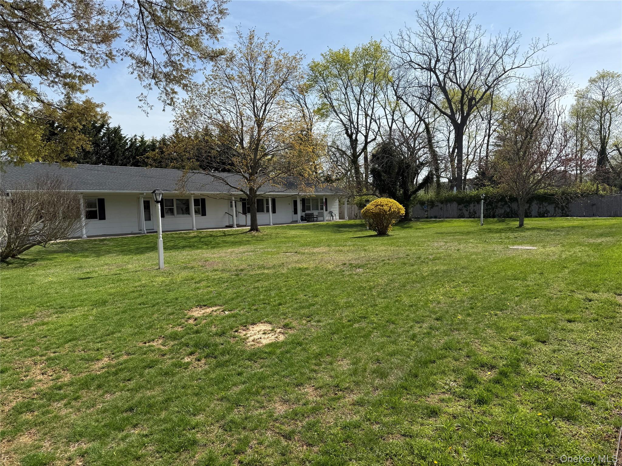 55075 Main Road, Unit YOUNGS BLDG #3 Southold, NY 11971 - Photo 8 of 16 a view of a house with backyard