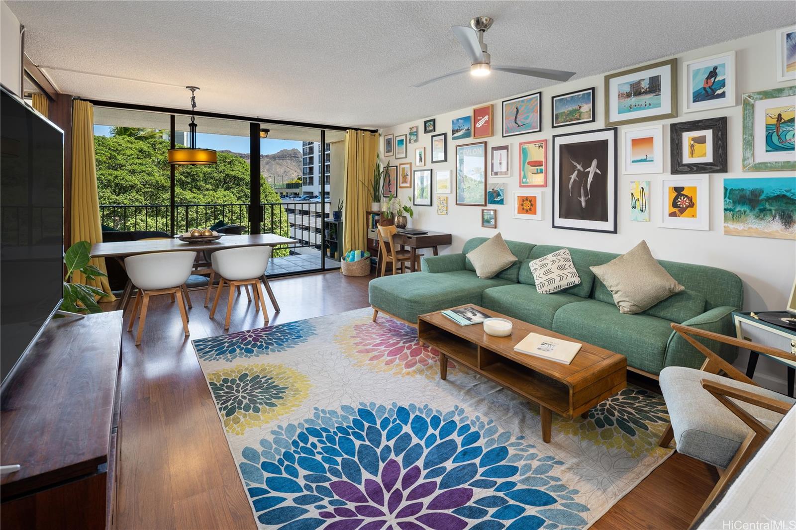 a living room with furniture dining table and a large window