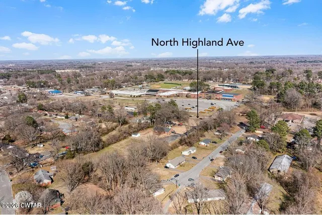 an aerial view of residential building and green space