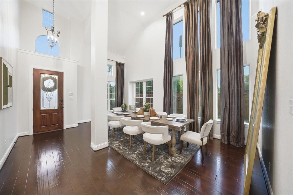 624 Sorrell Road McKinney, TX 75072 - Photo 3 of 28 a dining room with furniture and wooden floor