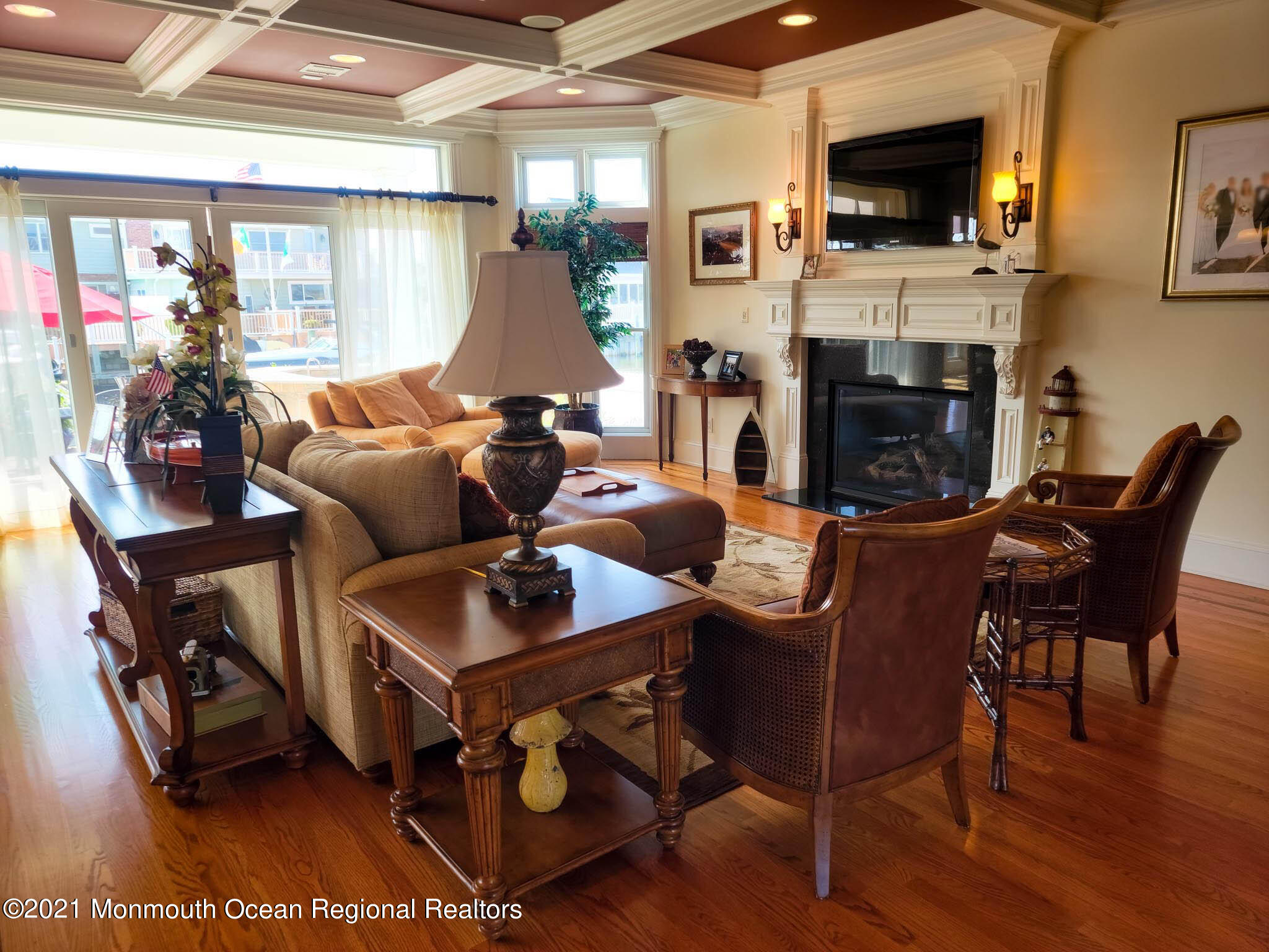 203 Ketch Road Mantoloking, NJ 08738 - Photo 17 of 88 a living room with furniture a flat screen tv and a fireplace