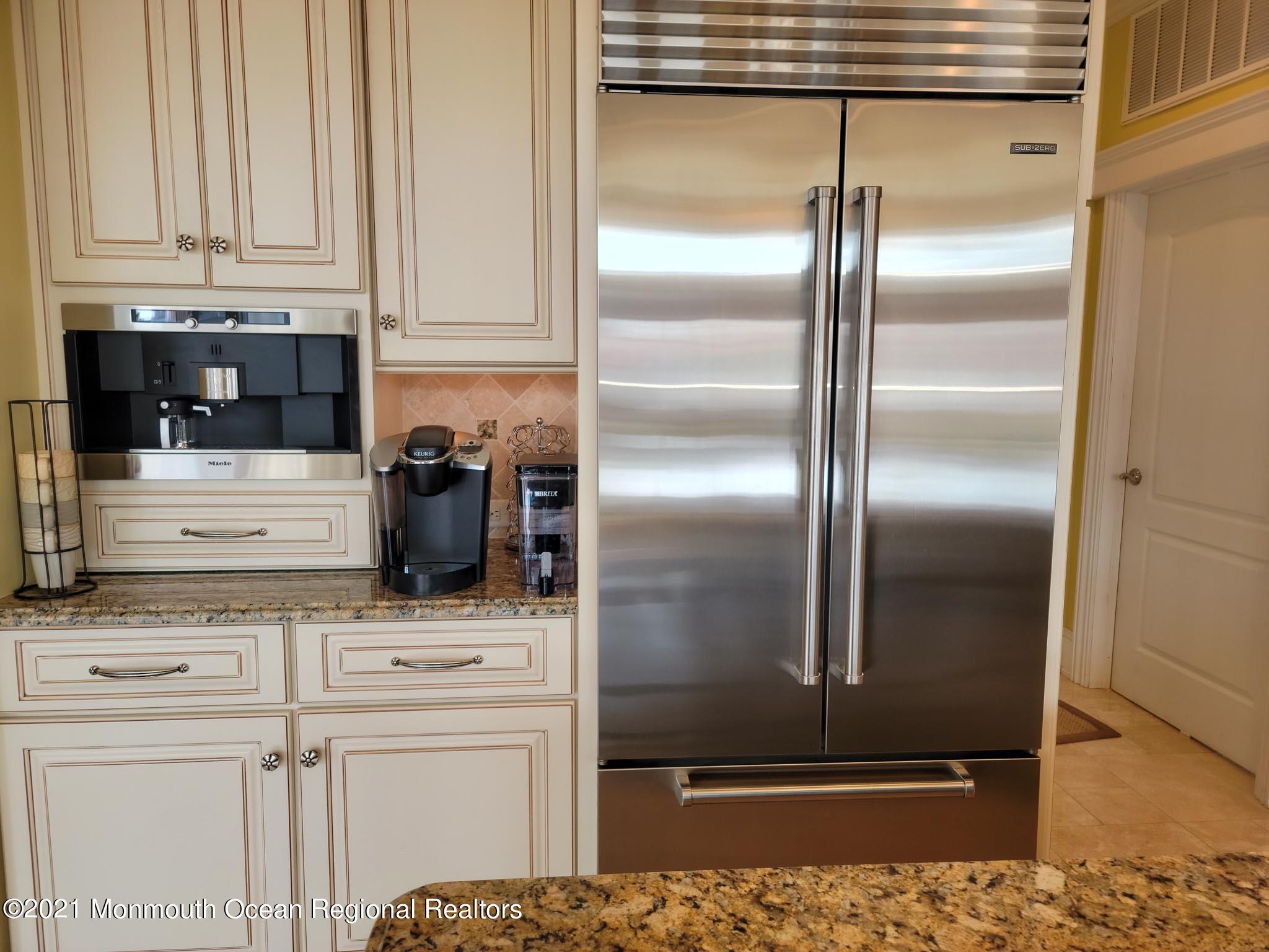 203 Ketch Road Mantoloking, NJ 08738 - Photo 25 of 88 a kitchen with appliances cabinets and a counter top space