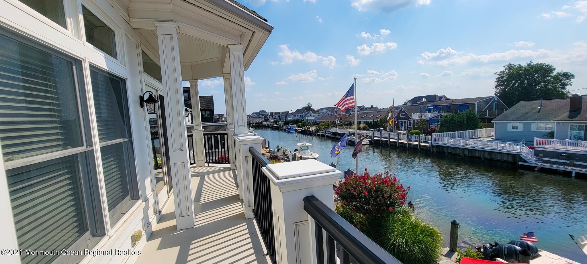 203 Ketch Road Mantoloking, NJ 08738 - Photo 57 of 88 a view of a lake with sitting area