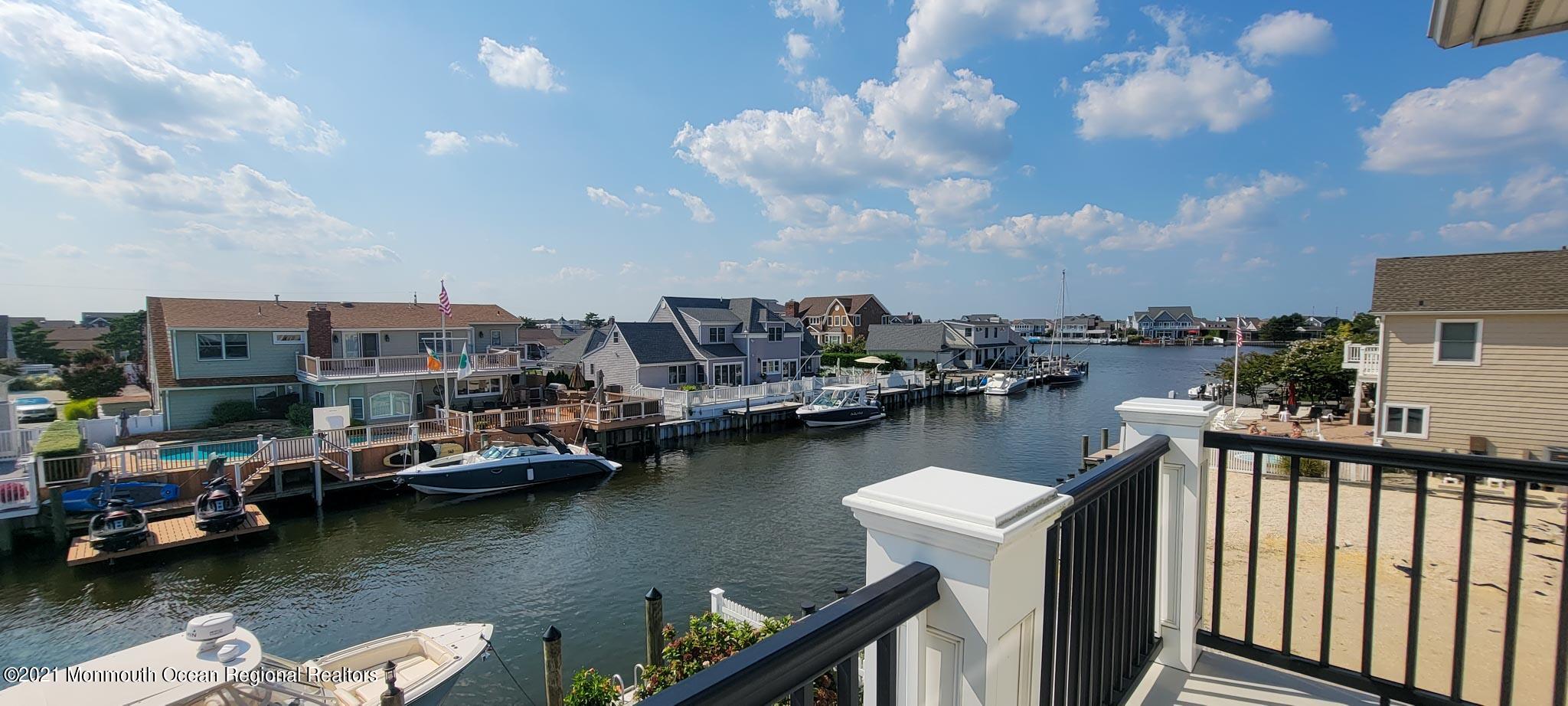 203 Ketch Road Mantoloking, NJ 08738 - Photo 58 of 88 a view of a lake with boats and trees