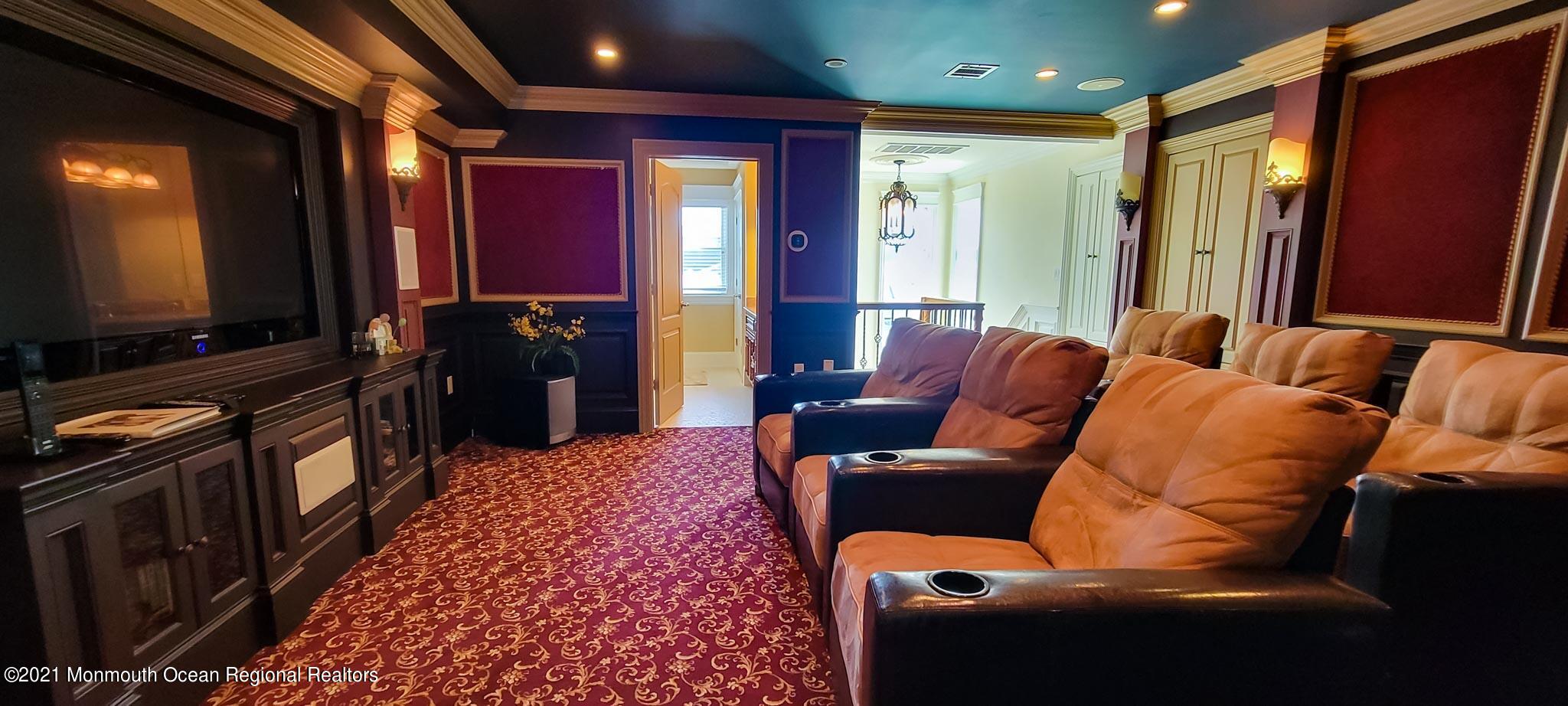 203 Ketch Road Mantoloking, NJ 08738 - Photo 63 of 88 a living room with furniture and a flat screen tv