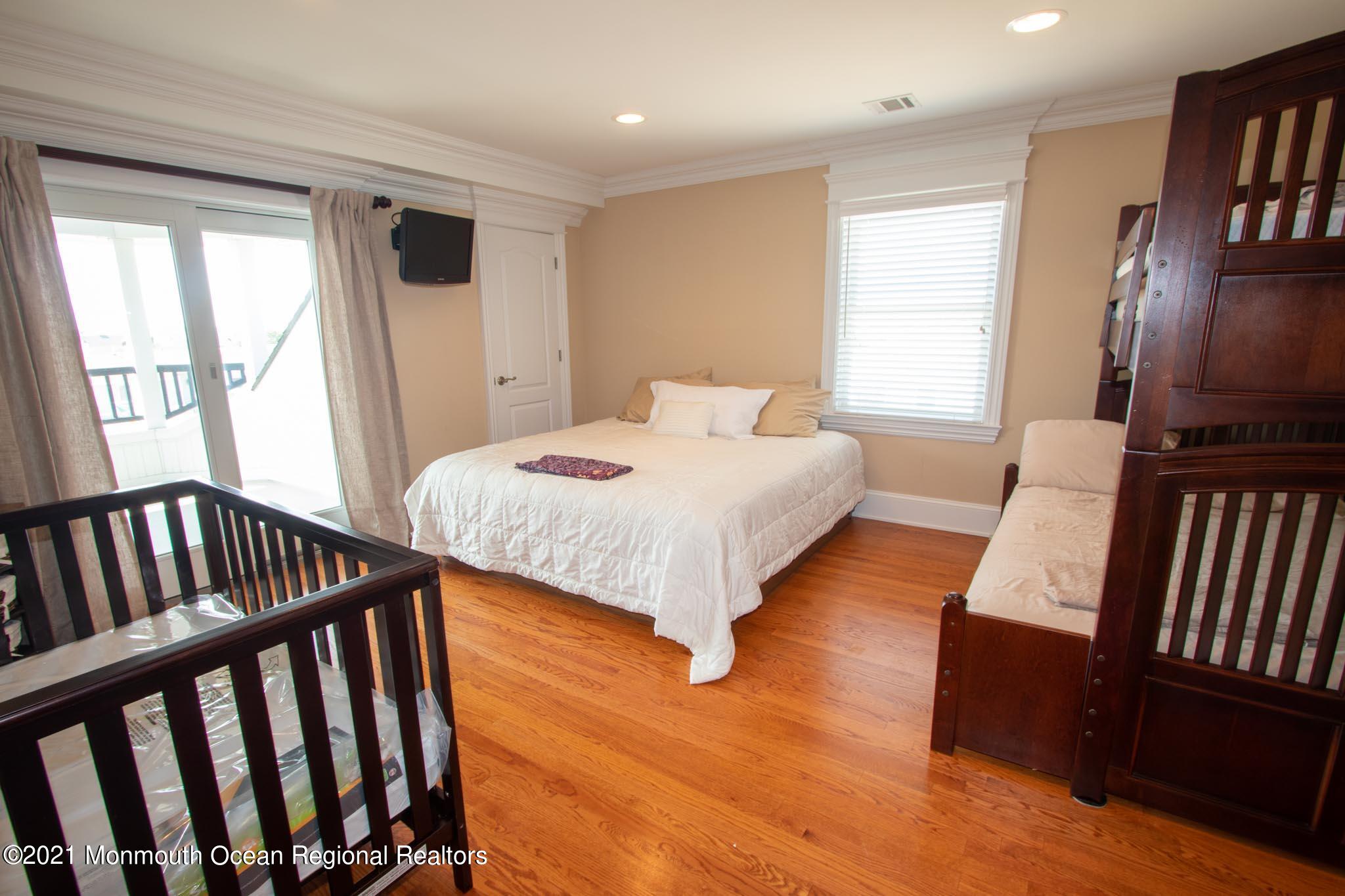 203 Ketch Road Mantoloking, NJ 08738 - Photo 67 of 88 a bedroom with two beds and a window